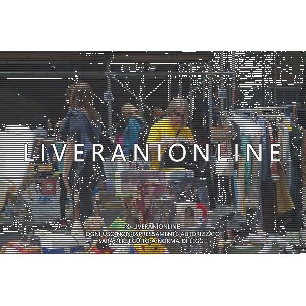 Shoppers search for bargains at the humongous Penn South Flea Market in the New York neighborhood of Chelsea on Saturday, June 4, 2011. Once a year the flea market, like Camelot, appears and the residents of the 20 building Penn South cooperatives clean out their closets in this giant flea market. (å© Richard B. Levine) /PHOTOSHOT/AG ALDO LIVERANI SAS - ITALY ONLY - *** Local Caption *** .