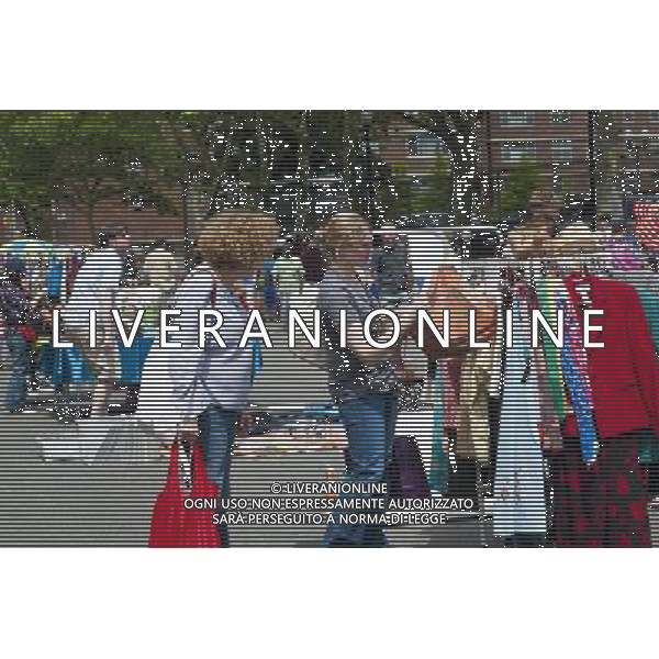 Shoppers search for bargains at the humongous Penn South Flea Market in the New York neighborhood of Chelsea on Saturday, June 4, 2011. Once a year the flea market, like Camelot, appears and the residents of the 20 building Penn South cooperatives clean out their closets in this giant flea market. (å© Richard B. Levine) /PHOTOSHOT/AG ALDO LIVERANI SAS - ITALY ONLY - *** Local Caption *** .