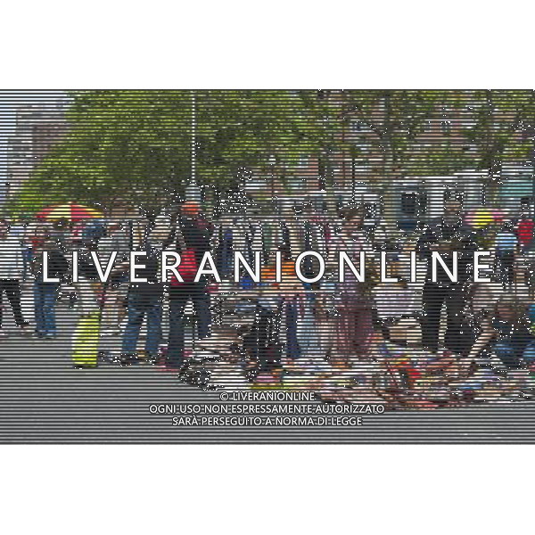 Shoppers search for bargains at the humongous Penn South Flea Market in the New York neighborhood of Chelsea on Saturday, June 4, 2011. Once a year the flea market, like Camelot, appears and the residents of the 20 building Penn South cooperatives clean out their closets in this giant flea market. (å© Richard B. Levine) /PHOTOSHOT/AG ALDO LIVERANI SAS - ITALY ONLY - *** Local Caption *** .