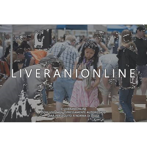 Shoppers search for bargains amidst the chaos of the Housing Works street fair in the New York neighborhood of Soho on Sunday, June 5, 2011. The service organization which aids people affected by HIV/AIDS holds it annual sale where thousands of books, movies, cds, records and articles of clothing are sold for a dollar or less, attracting thousands of people. (å© Richard B. Levine) /PHOTOSHOT/AG ALDO LIVERANI SAS - ITALY ONLY - *** Local Caption *** .