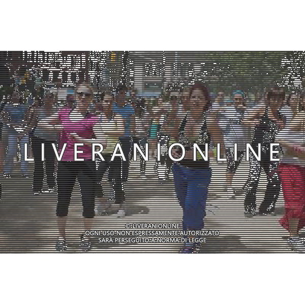 Exercisers participate in a Zumba class in Madison Square Park in New York on Monday, June 6, 2011 as part of the Parks \' Recreation Dept. BeFitNYC fitness activities. The city is offering a free or low cost programs to encourage physical activity and overall wellness in parks and recreation centers in the five boroughs and BeFitNYC on Facebook allows you to find, join and create group activities. (å© Richard B. Levine) /PHOTOSHOT/AG ALDO LIVERANI SAS - ITALY ONLY - *** Local Caption *** .