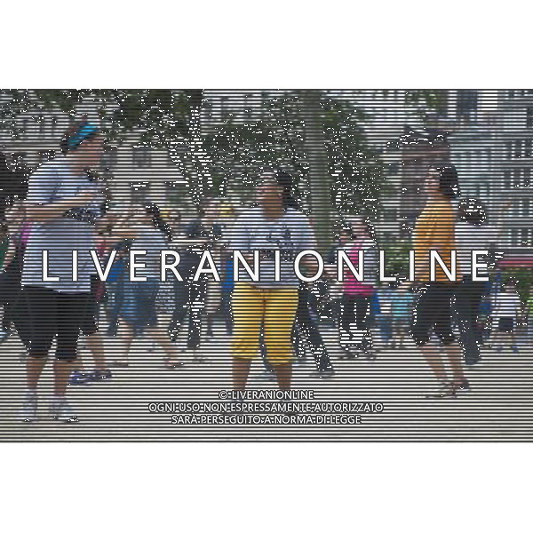 Exercisers participate in a Zumba class in Madison Square Park in New York on Monday, June 6, 2011 as part of the Parks \' Recreation Dept. BeFitNYC fitness activities. The city is offering a free or low cost programs to encourage physical activity and overall wellness in parks and recreation centers in the five boroughs and BeFitNYC on Facebook allows you to find, join and create group activities. (å© Richard B. Levine) /PHOTOSHOT/AG ALDO LIVERANI SAS - ITALY ONLY - *** Local Caption *** .