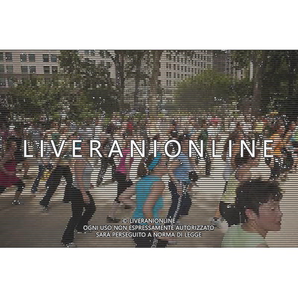 Exercisers participate in a Zumba class in Madison Square Park in New York on Monday, June 6, 2011 as part of the Parks \' Recreation Dept. BeFitNYC fitness activities. The city is offering a free or low cost programs to encourage physical activity and overall wellness in parks and recreation centers in the five boroughs and BeFitNYC on Facebook allows you to find, join and create group activities. (å© Richard B. Levine) /PHOTOSHOT/AG ALDO LIVERANI SAS - ITALY ONLY - *** Local Caption *** .