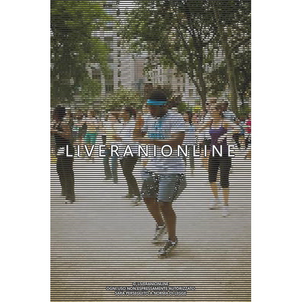 Exercisers participate in a Zumba class in Madison Square Park in New York on Monday, June 6, 2011 as part of the Parks \' Recreation Dept. BeFitNYC fitness activities. The city is offering a free or low cost programs to encourage physical activity and overall wellness in parks and recreation centers in the five boroughs and BeFitNYC on Facebook allows you to find, join and create group activities. (å© Richard B. Levine) /PHOTOSHOT/AG ALDO LIVERANI SAS - ITALY ONLY - *** Local Caption *** .