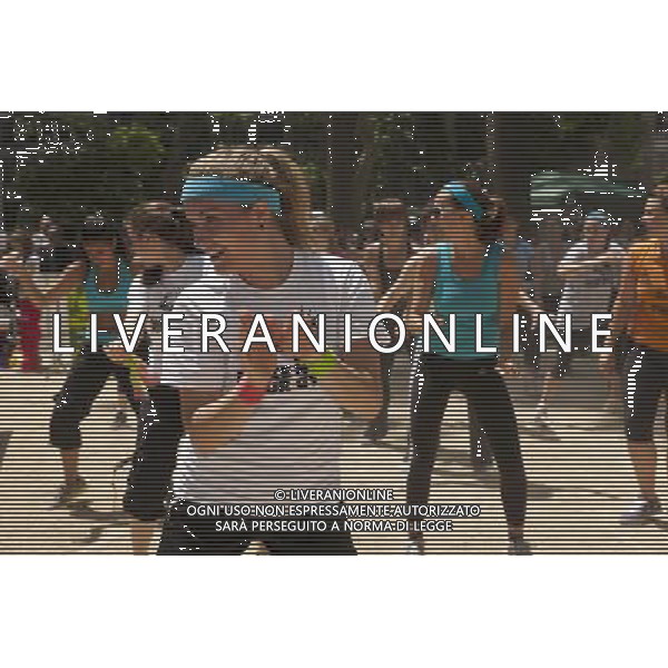 Exercisers participate in a Zumba class in Madison Square Park in New York on Monday, June 6, 2011 as part of the Parks \' Recreation Dept. BeFitNYC fitness activities. The city is offering a free or low cost programs to encourage physical activity and overall wellness in parks and recreation centers in the five boroughs and BeFitNYC on Facebook allows you to find, join and create group activities. (å© Richard B. Levine) /PHOTOSHOT/AG ALDO LIVERANI SAS - ITALY ONLY - *** Local Caption *** .