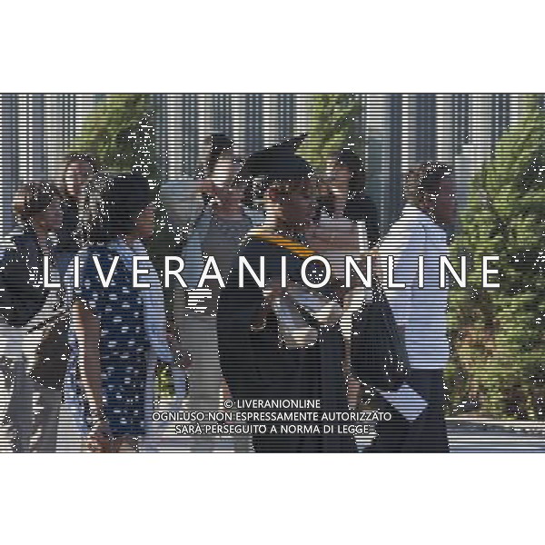 Very recent graduates and their friends and families outside of the Jacob Javits Convention Center in New York after the 45th commencement exercises of John Jay College of Criminal Justice,The City University of New York, on Friday, June 3, 2011. (å© Richard B. Levine) /PHOTOSHOT/AG ALDO LIVERANI SAS - ITALY ONLY - *** Local Caption *** .