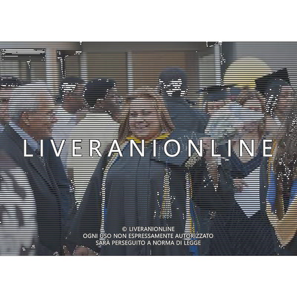 Very recent graduates and their friends and families outside of the Jacob Javits Convention Center in New York after the 45th commencement exercises of John Jay College of Criminal Justice,The City University of New York, on Friday, June 3, 2011. (å© Richard B. Levine) /PHOTOSHOT/AG ALDO LIVERANI SAS - ITALY ONLY - *** Local Caption *** .