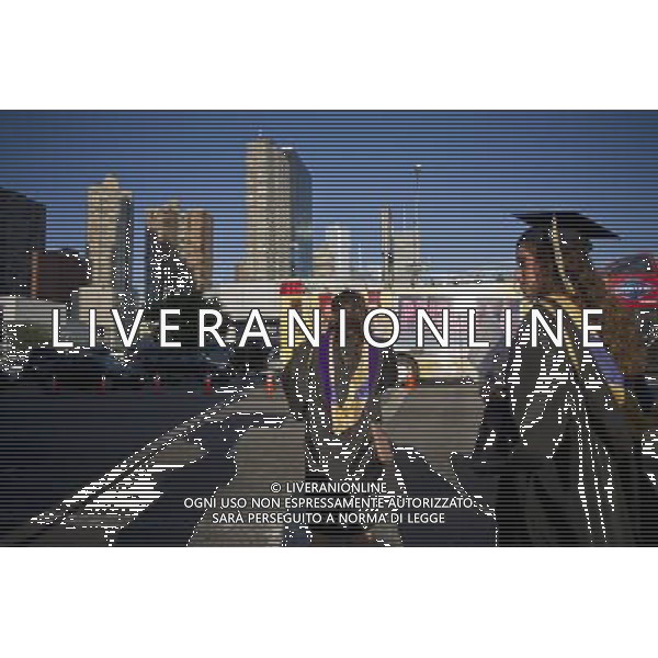 Very recent graduates and their friends and families outside of the Jacob Javits Convention Center in New York after the 45th commencement exercises of John Jay College of Criminal Justice,The City University of New York, on Friday, June 3, 2011. (å© Frances M. Roberts) /PHOTOSHOT/AG ALDO LIVERANI SAS - ITALY ONLY - *** Local Caption *** .