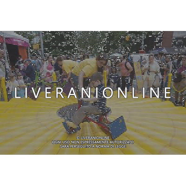 Visitors to the World Science Festival Street Fair peddle a square wheeled tricycle in Greenwich Village in New York on Sunday, June 5, 2011. The week-long festival culminates with a giant street fair with interactive exhibits, experiments, games, and other participatory activities to foster interest in the various sciences. (å© Richard B. levine) /PHOTOSHOT/AG ALDO LIVERANI SAS - ITALY ONLY - *** Local Caption *** .