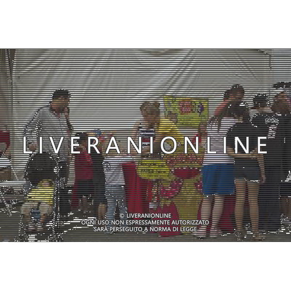 Visitors to the World Science Festival Street Fair make toys from recycled paper products in Greenwich Village in New York on Sunday, June 5, 2011. The week-long festival culminates with a giant street fair with interactive exhibits, experiments, games, and other participatory activities to foster interest in the various sciences. (å© Frances M. Roberts) /PHOTOSHOT/AG ALDO LIVERANI SAS - ITALY ONLY - *** Local Caption *** .