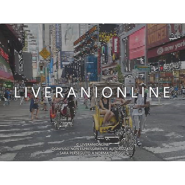 Pedicab drivers are seen on Wednesday, June 8, 2011 walking their passengers on an uphill stretch of Broadway near Times Square in New York. (å© Richard B. Levine) /PHOTOSHOT/AG ALDO LIVERANI SAS - ITALY ONLY - *** Local Caption *** .