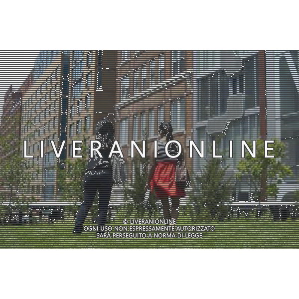 Visitors enjoy the Great Lawn area on opening day of the second phase, from West 20th Street to West 30th Street, of the High Line Park in Chelsea is seen on Tuesday, June 7, 2011. The new section includes the 4900 square foot lawn for visitors to sit and sunbathe as well as a \'flyover\' walkway that raises you eight feet above the foliage. Since the first section opened millions of dollars in real estate has been developed along the park. (å© Frances M. Roberts) /PHOTOSHOT/AG ALDO LIVERANI SAS - ITALY ONLY - *** Local Caption *** .