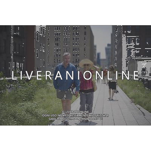 Opening day of the second phase, from West 20th Street to West 30th Street, of the High Line Park in Chelsea is seen on Tuesday, June 7, 2011. The new section includes a lawn for visitors to sit and sunbathe as well as a \'flyover\' walkway that raises you eight feet above the foliage. Since the first section opened millions of dollars in real estate has been developed along the park. (Œ© Frances M. Roberts) /PHOTOSHOT/AG ALDO LIVERANI SAS - ITALY ONLY - *** Local Caption *** .