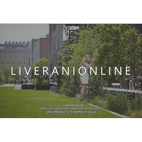 Visitors enjoy the Great Lawn area on opening day of the second phase, from West 20th Street to West 30th Street, of the High Line Park in Chelsea is seen on Tuesday, June 7, 2011. The new section includes the 4900 square foot lawn for visitors to sit and sunbathe as well as a \'flyover\' walkway that raises you eight feet above the foliage. Since the first section opened millions of dollars in real estate has been developed along the park. (Œ© Richard B. Levine) /PHOTOSHOT/AG ALDO LIVERANI SAS - ITALY ONLY - *** Local Caption *** .