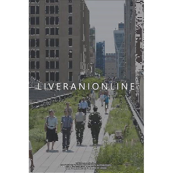 Opening day of the second phase, from West 20th Street to West 30th Street, of the High Line Park in Chelsea is seen on Tuesday, June 7, 2011. The new section includes a lawn for visitors to sit and sunbathe as well as a \'flyover\' walkway that raises you eight feet above the foliage. Since the first section opened millions of dollars in real estate has been developed along the park. (Œ© Richard B. Levine) /PHOTOSHOT/AG ALDO LIVERANI SAS - ITALY ONLY - *** Local Caption *** .