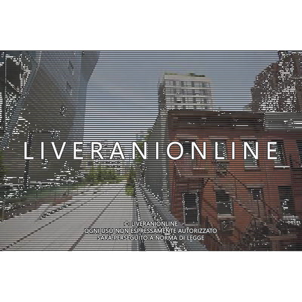Both old and new real estate adjoining the park, seen on opening day of the second phase, from West 20th Street to West 30th Street, of the High Line Park in Chelsea is seen on Tuesday, June 7, 2011. The new section includes a lawn for visitors to sit and sunbathe as well as a \'flyover\' walkway that raises you eight feet above the foliage. Since the first section opened millions of dollars in real estate has been developed along the park. (Œ© Richard B. Levine) /PHOTOSHOT/AG ALDO LIVERANI SAS - ITALY ONLY - *** Local Caption *** .