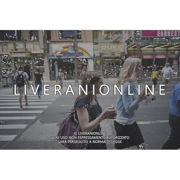 Pedestrians cool off with ice cream from Cold Stone Creamery in Times Square in New York on Thursday, June 9, 2011 . Today was the third day of over 90 degree weather in the city officially making it a heat wave. (å© Richard B. Levine) /PHOTOSHOT/AG ALDO LIVERANI SAS - ITALY ONLY - *** Local Caption *** .