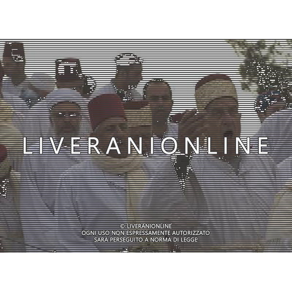 (110612) -- WEST BANK, JUNE 12, 2011 () -- Samaritans perform traditional pilgrimage ceremony marking the holiday of Shavuot atop Gerizim Mount near the West Bank city of Nablus, June 12, 2011. Named for Samaria, a region in the northern West Bank, the Samaritans believe themselves to be the remnants of Israelis exiled by the Assyrians in 722 B.C.. They practice a religion closely linked to Judaism and venerate a version of the Old Testament, but are not Jews. (/Fadi Arouri) Samaritani eseguono la tradizionale cerimonia che segna il pellegrinaggio per la festa di Shavuot in cima al Monte Garizim, vicino alla cittö cisgiordana di Nablus AG. ALDO LIVERANI SAS - ITALY ONLY *** Local Caption *** .