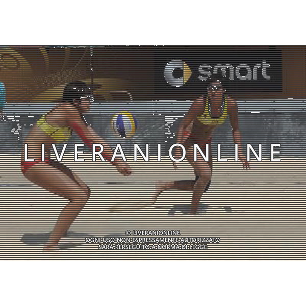 (110616) -- ROME, June 16, 2011 () -- China\'s pair Huang Ying (R) /Yue Yuan compete during the women\'s round 32 match against Australia\'s pair Louise Bawden/Becchara Palmer at the 2011 FIVB Beach Volleyball World Championships in Rome, Italy, June 16, 2011. Huang Ying/Yue Yuan lost 1-2. (/Wang Qingqin) ©photoshot/Agenzia Aldo Liverani Sas - ITALY ONLY - Mondiali di Beach Volley FIVB di Roma, Italia 16 giugno 2011.