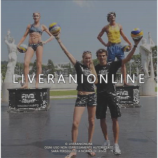 (110616) -- ROME, June 16, 2011 () -- Olympic beach volleyball champions Kerri Walsh (L) of the United States and Emanuel Rego of Brazil have photos taken before the statues of themselves to mark the launch of the \'FIVB Heroes\' campaign, during the 2011 FIVB Beach Volleyball World Championships in Rome, Italy, June 16, 2011. () ©photoshot/Agenzia Aldo Liverani Sas - ITALY ONLY - Mondiali di Beach Volley FIVB di Roma, Italia 16 giugno 2011.