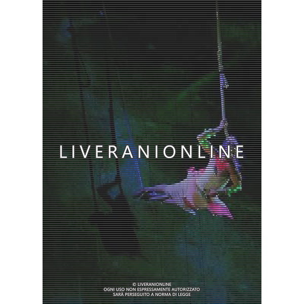 JERUSALEM, June 15, 2011 An acrobat performs in \'The Butterfly Effect\', accompanied by video projection and innovative flight systems, during the 3rd Jerusalem Festival of Light, on the wall of the Old City of Jerusalem, June 15, 2011. \'The Butterfly Effect\' tells the story of two ancient cultures, fighting one another for the control of light. (/Yin Dongxun) AG ALDO LIVERANI S A S ONLY ITALY