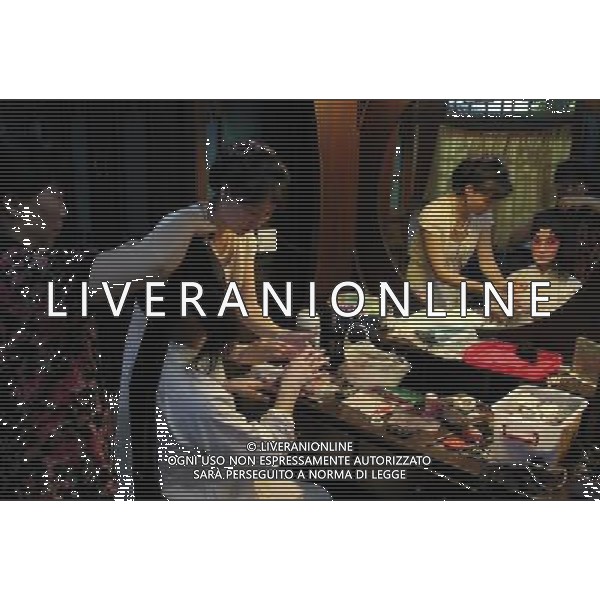 (110619) -- BEIJING, June 19, 2011 -- An opera singer from the Jiangsu Provincial Kun Opera Troupe is reflected in a mirror backstage while two assistants help her apply make-up before a performance in Beijing, capital of China, June 18, 2011. A joint performance was staged here Saturday to mark the 10th anniversary of Kun Opera\'s inscription on the World Heritage list. Kun Opera, or \'Kun Qu\' as it is called in Chinese, is one of the oldest extant forms of the Chinese opera, which dates back more than 600 years. Tang Shizeng) (ljh) AG ALDO LIVERANI S A S ONLY ITALY