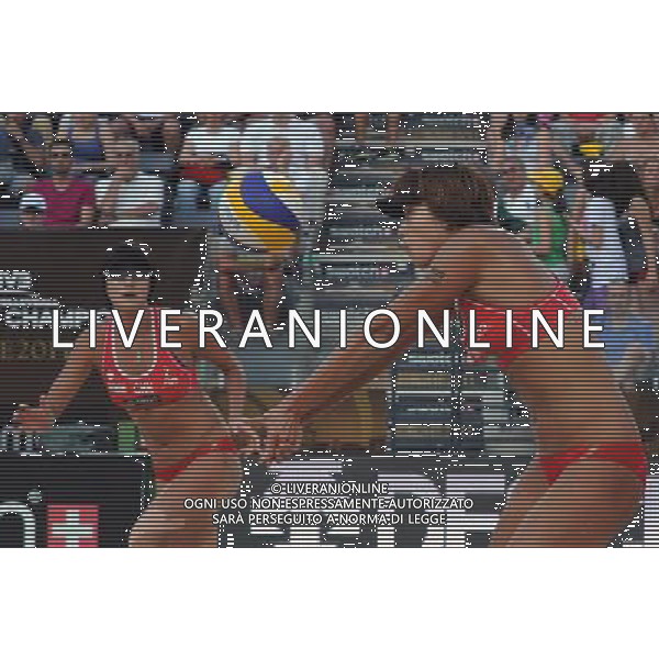 (110619) -- ROME, June 19, 2011 -- Chinese player Xue Chen (R) receives the ball during the women\'s semifinal between China\'s pair Xue Chen/Zhang Xi and United States\' Misty May-Treanor/Kerri Walsh at the 2011 FIVB Beach Volleyball World Championships in Rome, Italy, June 18, 2011. May-Treanor/Walsh won 2-1 to enter the final. Wang Qingqin) AG ALDO LIVERANI S A S ONLY ITALY