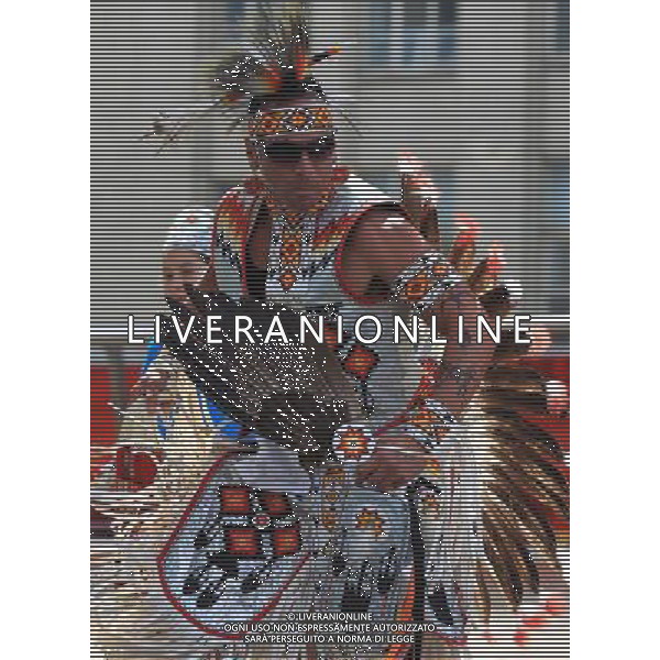 (110621) -- TORONTO, June 21, 2011 () -- An Aboriginal performs during the event marking the National Aboriginal Day at the Yonge-Dundas Square in central Toronto, Canada, June 21, 2011. The National Aboriginal Day is annually held on June 21 in Canada to celebrate the unique heritage, diverse cultures, and outstanding achievements of the nation\'s Aboriginal peoples. (/Zou Zheng) (wjd) L\'annuale Giornata Nazionale aborigena per celebrare il patrimonio unico, la diverse culture, e le realizzazioni eccezionali dei popoli aborigeno del Canada . Ag. Aldo Liverani sas - ITALY ONLY *** Local Caption *** .