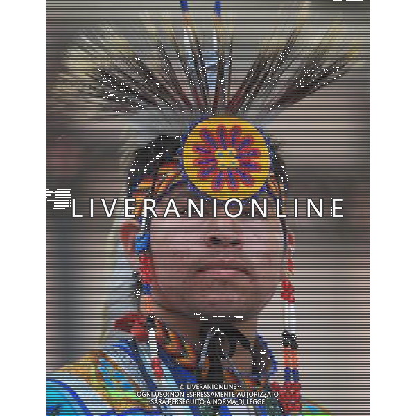 (110621) -- TORONTO, June 21, 2011 () -- An Aboriginal performs during the event marking the National Aboriginal Day at the Yonge-Dundas Square in central Toronto, Canada, June 21, 2011. The National Aboriginal Day is annually held on June 21 in Canada to celebrate the unique heritage, diverse cultures, and outstanding achievements of the nation\'s Aboriginal peoples. (/Zou Zheng) (wjd) L\'annuale Giornata Nazionale aborigena per celebrare il patrimonio unico, la diverse culture, e le realizzazioni eccezionali dei popoli aborigeno del Canada . Ag. Aldo Liverani sas - ITALY ONLY *** Local Caption *** .