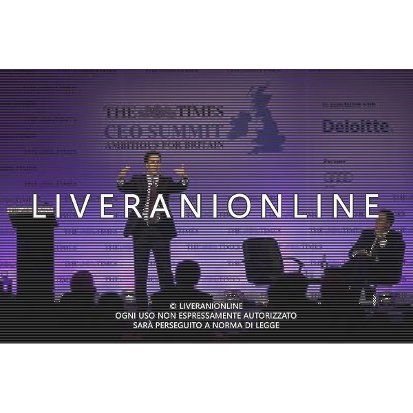 Leader of the Labour Party Ed Miliband addresses the Times CEO Summit at the Savoy Hotel in central London, watched by Times Editor James Harding. ©photoshot/Agenzia Aldo Liverani Sas - ITALY ONLY - Vertice Ceo del Times al Savoy Hotel nel centro di Londra