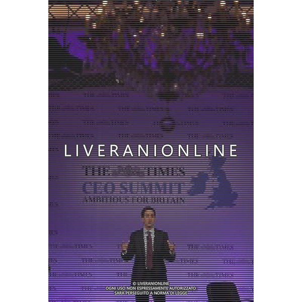 Leader of the Labour Party Ed Miliband addresses the Times CEO Summit at the Savoy Hotel in central London, watched by Times Editor James Harding. ©photoshot/Agenzia Aldo Liverani Sas - ITALY ONLY - Vertice Ceo del Times al Savoy Hotel nel centro di Londra