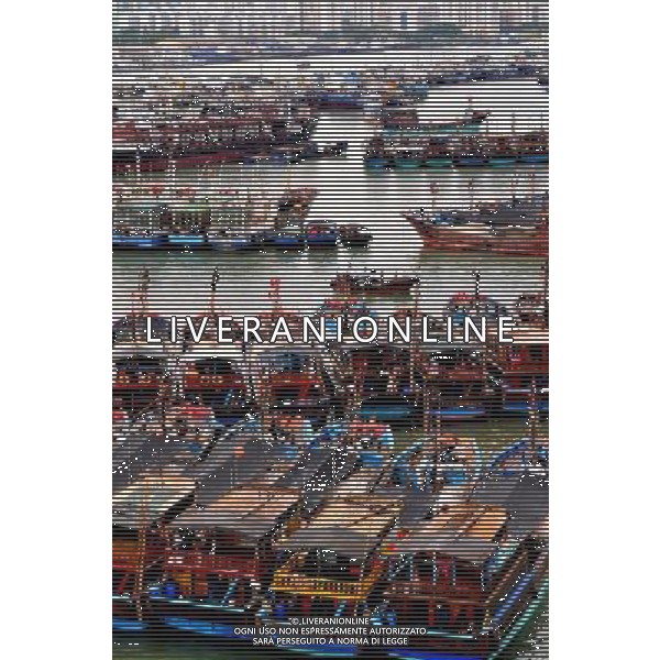 HAIKOU, June 22, 2011 Fishing vessels anchor at Xingang Port to take shelter from the approaching tropical storm in Haikou, capital of south China\'s Hainan Province, June 22, 2011. A new tropical storm, the fourth this year, formed early Tuesday morning and is expected to land in Guangdong from Wednesday night to Thursday morning. The National Meteorological Center has issued a typhoon alarm. (/Pan Qinghua) (mcg) Porto di Haikou , sospesi i servizi di navigazione attraverso lo stretto Qiongzhou per l\'imminente arrivo di una tempesta tropicale - AG. ALDO LIVERANI SAS - ITALY ONLY *** Local Caption *** .