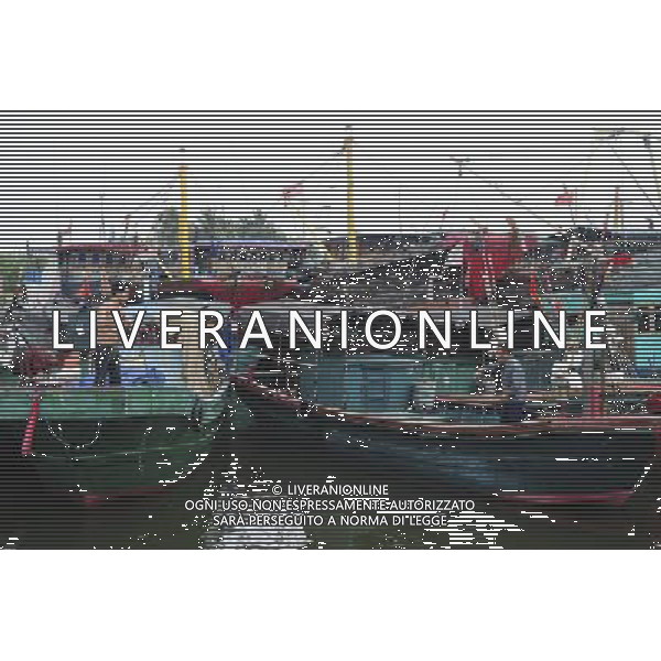 QIONGHAI, June 22, 2011 Fishing vessels anchor at Tanmen Port to take shelter from the approaching tropical storm in Qionghai, south China\'s Hainan Province, June 22, 2011. A new tropical storm, the fourth this year, formed early Tuesday morning and is expected to land in Guangdong from Wednesday night to Thursday morning. The National Meteorological Center has issued a typhoon alarm. (/Meng Zhongde) (mcg) Porto di Haikou , sospesi i servizi di navigazione attraverso lo stretto Qiongzhou per l\'imminente arrivo di una tempesta tropicale - AG. ALDO LIVERANI SAS - ITALY ONLY *** Local Caption *** .