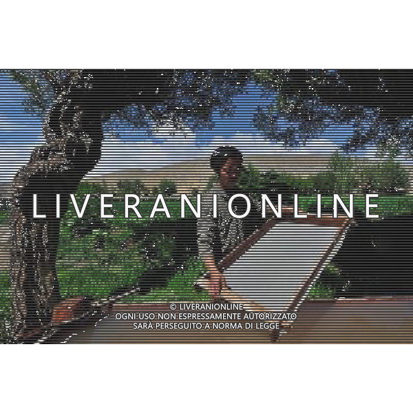 NYINMO, June 23, 2011 Gesang Dianzin makes Nyinmo paper in Nyinmo, southwest China\'s Tibet Autonomous Region, June 22, 2011. The time honored Nyinmo paper is one of the three types of Tibetan traditional handmade paper. The paper is made from a kind of grass root. The grass root is poisonous, so paper made from it will not corrode or be eaten by insects, and it can keep intact for long. Nyinmo paper is widely used in printing documents and sutra in Tibet. Thanks to its durability, many ancient books are well preserved. (/Tao Xiyi) (hdt)