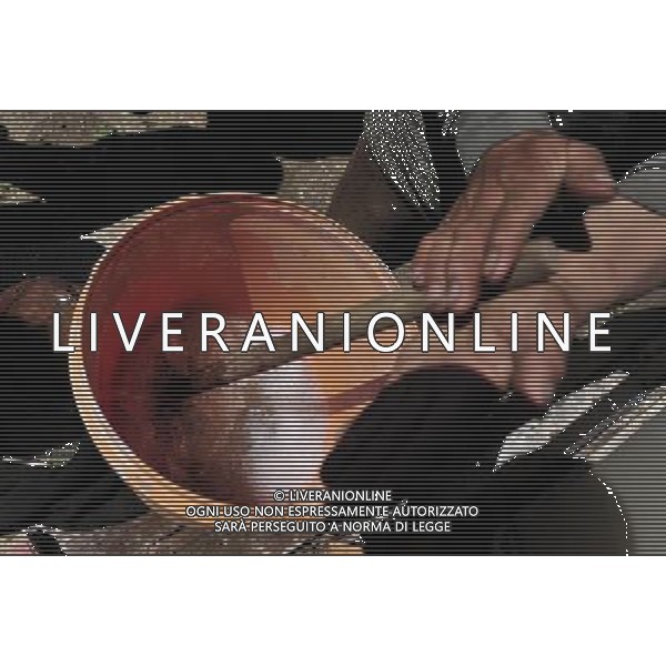 NYINMO, June 23, 2011 Gesang Dianzin mills the paper pulp during the process of making Nyinmo paper in Nyinmo, southwest China\'s Tibet Autonomous Region, June 22, 2011. The time honored Nyinmo paper is one of the three types of Tibetan traditional handmade paper. The paper is made from a kind of grass root. The grass root is poisonous, so paper made from it will not corrode or be eaten by insects, and it can keep intact for long. Nyinmo paper is widely used in printing documents and sutra in Tibet. Thanks to its durability, many ancient books are well preserved. (/Tao Xiyi) (hdt)