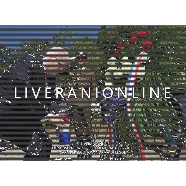 SISAK, June 22, 2011 Croatian President Ivo Josipovic (L) lays a bunch of flowers and a candle at the monument erected in tribute to the first 79 strong Partisan Unit in Brezovica Forest near Sisak, Croatia, June 22, 2011. The main commemoration observing Croatia\'s Anti Fascist Struggle Day marks the 70th anniversary of the establishment of the first anti fascist armed unit in Croatia. First partisans brigade was formed in Croatian Brezovica forest on June 22, 1941. (/Miso Lisanin) (msq)