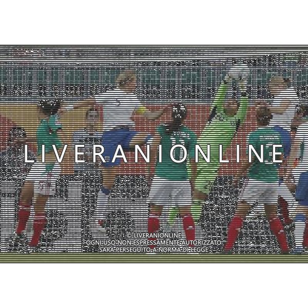 WOLFSBURG, June 27, 2011 Mexican goalkeeper Cecilia Santiago (3rd R) saves the ball during the first round Group B match against England at the FIFA Women\'s World Cup Germany 2011 at the Arena im Allerpark in Wolfsburg, north Germany, June 27, 2011. The match ended in a 1 1 draw. (/Ding Xu)(wjd)