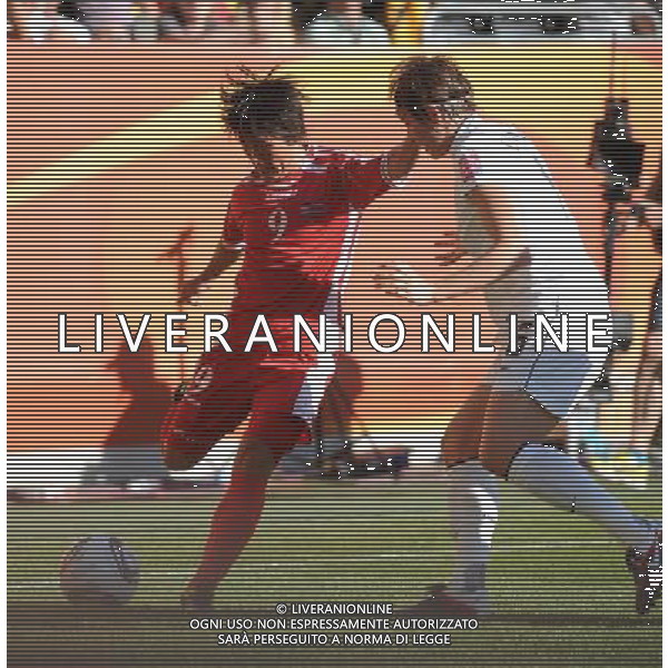 (110629) -- DRESDEN, June 29, 2011 () -- Ra Un Sim (L) of the Democratic People\'s Republic of Korea (DPRK) competes during the Group C first round match against the United States at the 2011 FIFA Women\'s World Cup at the Rudolf-Harbig-Stadion in Dresden, Germany, June 28, 2011. (/Li Jundong)