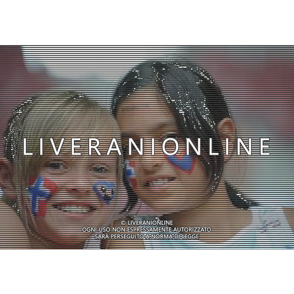 (110629) -- AUGSBURG, Jun. 29, 2011 () -- Two girl fans react before the Group D match between Equatorial Guinea and Norway at the 2011 FIFA Women\'s World Cup in Augsburg, Germany, June 29, 2011. (/Li Jundong)