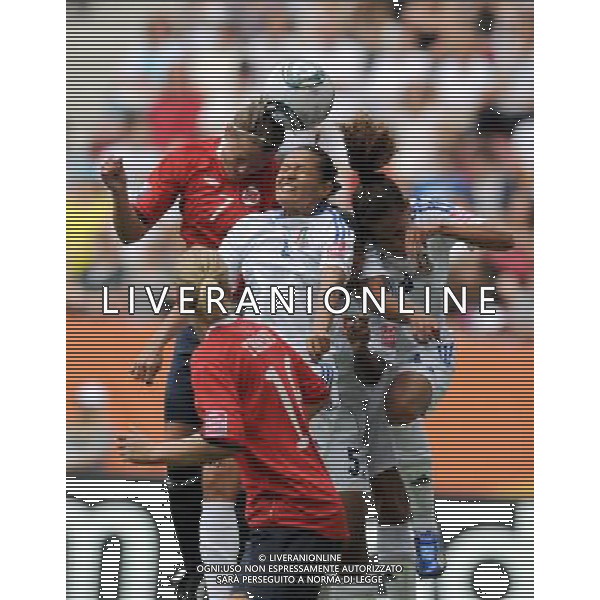 (110629) -- AUGSBURG, Jun. 29, 2011 () -- Tine Ronning (L above) of Norway vies with Ana Cristina (C above) of Equatorial Guinea during the Group D match at the 2011 FIFA Women\'s World Cup in Augsburg, Germany, June 29, 2011. (/Li Jundong)