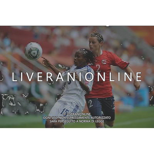 (110629) -- AUGSBURG, Jun. 29, 2011 () -- Chinasa (L) of Equatorial Guinea vies with Nora Holstad Berge of Norway during their Group D match at the 2011 FIFA Women\'s World Cup in Augsburg, Germany, June 29, 2011. (/Li Jundong)