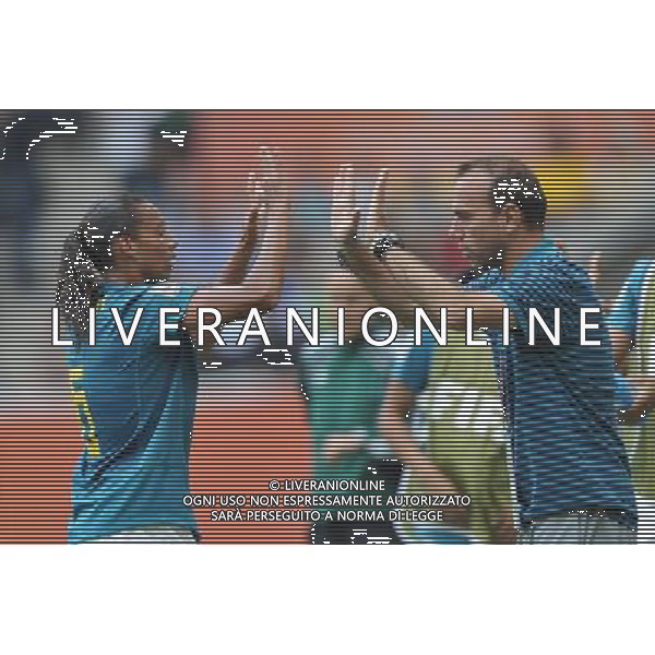 (110630) -- MONCHEGLADBACH, June 30, 2011 () -- Brazilian player Rosana (L) celebrates her goal with head coach Kleiton Lima during the first round Group D match between Brazil and Australia at the FIFA Women\'s World Cup Germany 2011 in Monchengladbach, Germany, June 29, 2011.Brazil won with 1-0. (/Wu Wei)