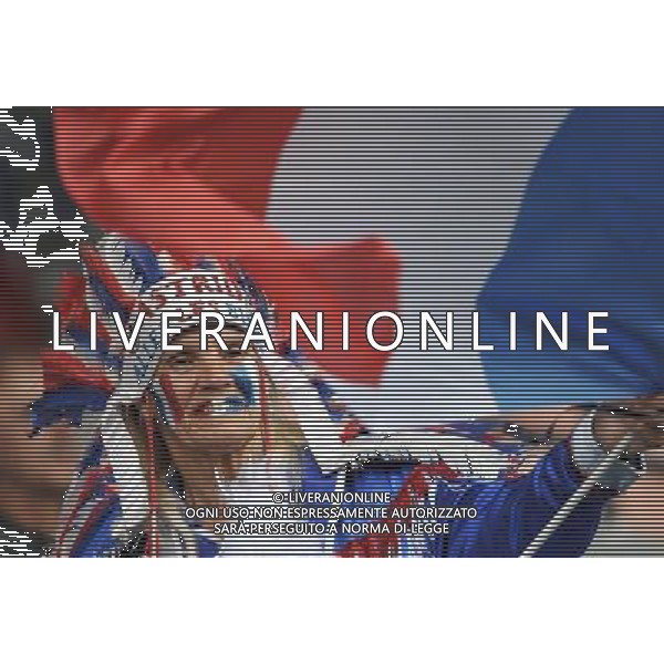 BOCHUM, July 1, 2011 A supporter of France waves French national flag prior to the second round Group A match between France and Canada at the FIFA Women\'s World Cup Germany 2011 in Bochum, Germany, June 30, 2011. France won the match 4 0. (/Ma Ning) (djj)