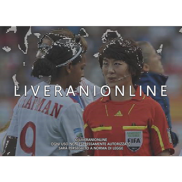 BOCHUM, July 1, 2011 Assistant Referee Zhang Lingling from China (R) is seen during the second round Group A match between France and Canada at the FIFA Women\'s World Cup Germany 2011 in Bochum, Germany, June 30, 2011. (/Wu Wei) (djj)