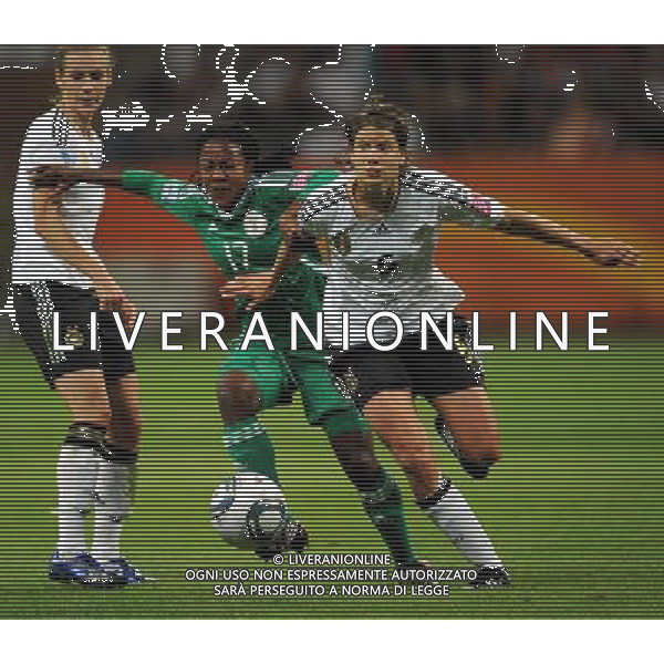 FRANKFURT, July 1, 2011 Germany\'s player Annike Krahn (R) vies with Nigeria\'s Francisca Ordega (C) during the second round Group A match between Germany and Nigeria at the FIFA Women\'s World Cup Germany 2011 in Frankfurt, Germany, June 30, 2011. Germany won the match 1 0. (/Li Jundong) (djj)