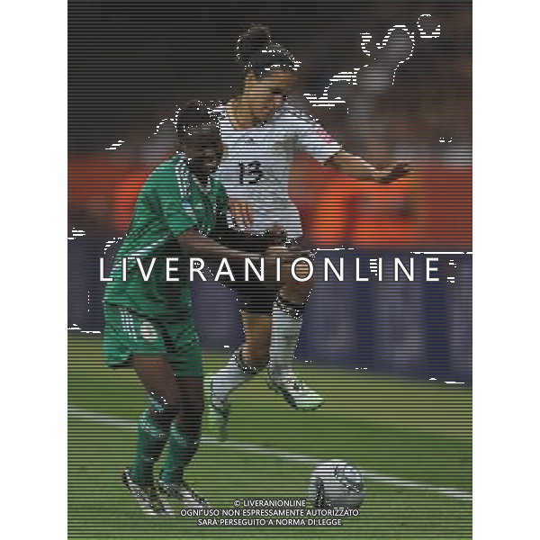FRANKFURT, July 1, 2011 Germany\'s player Celia Okoyino Da Mbabi (R) vies with Nigeria\'s Perpetua Nkwocha during the second round Group A match between Germany and Nigeria at the FIFA Women\'s World Cup Germany 2011 in Frankfurt, Germany, June 30, 2011. Germany won the match 1 0. (/Xu Liang) (djj)