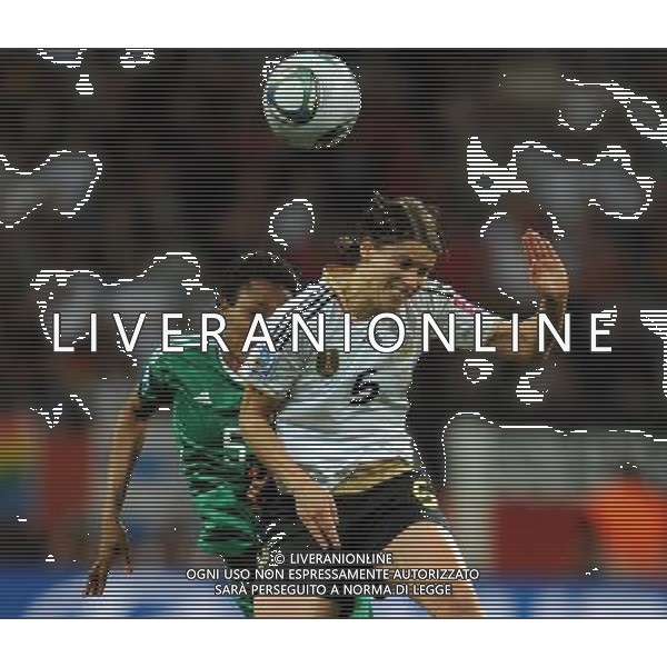 FRANKFURT, July 1, 2011 Germany\'s player Annike Krahn (R) vies with Nigeria\'s Onome Ebi during the second round Group A match between Germany and Nigeria at the FIFA Women\'s World Cup Germany 2011 in Frankfurt, Germany, June 30, 2011. Germany won the match 1 0. (/Li Jundong) (djj)