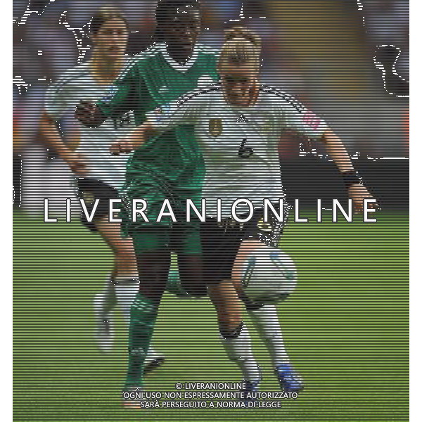 FRANKFURT, July 1, 2011 Germany\'s player Simone Laudehr (front) carries the ball during the second round Group A match between Germany and Nigeria at the FIFA Women\'s World Cup Germany 2011 in Frankfurt, Germany, June 30, 2011. Germany won the match 1 0. (/Li Jundong) (djj)