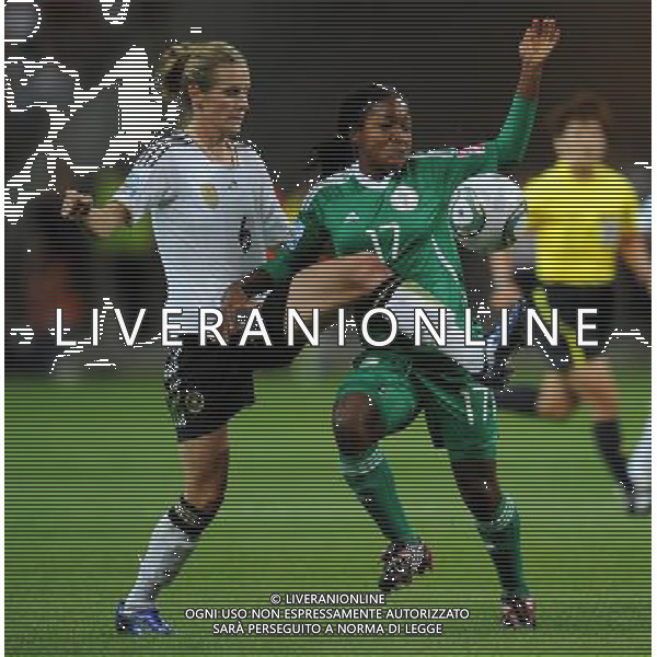 FRANKFURT, July 1, 2011 Germany\'s player Simone Laudehr (L) vies with Nigeria\'s Francisca Ordega during the second round Group A match between Germany and Nigeria at the FIFA Women\'s World Cup Germany 2011 in Frankfurt, Germany, June 30, 2011. Germany won the match 1 0. (/Li Jundong) (djj)