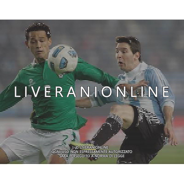 (110702) -- LA PLATA, July 2, 2011 -- Edivaldo Rojas (L) of Bolivia fights for the ball with Lionel Messi of Argentina during the opening match of Copa America 2011 in La Plata, Argentina, on July 1, 2011. The two teams played to a 1-1 tie. Alberto Ragio) (djj)